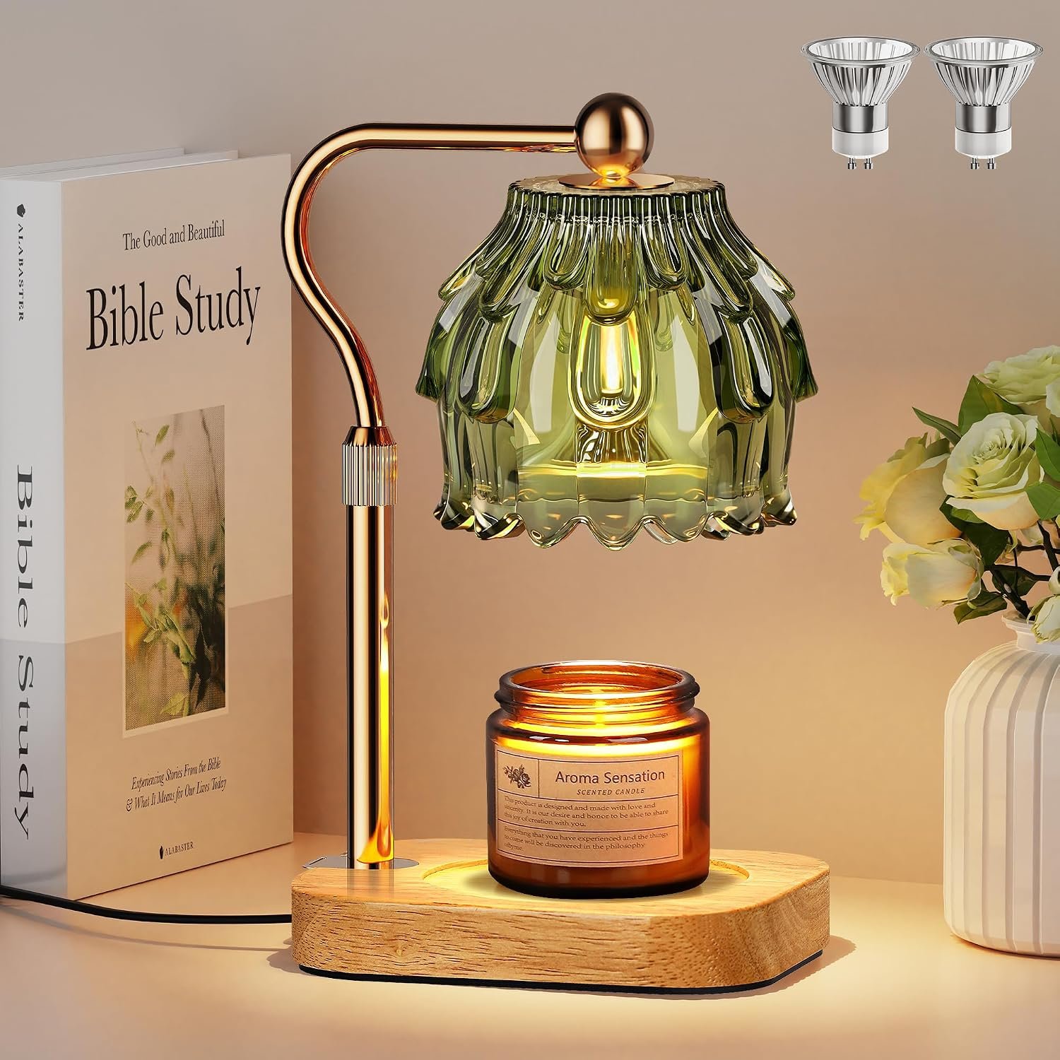 Gold candle warmer lamp with flower glass shade melting a scented jar candle