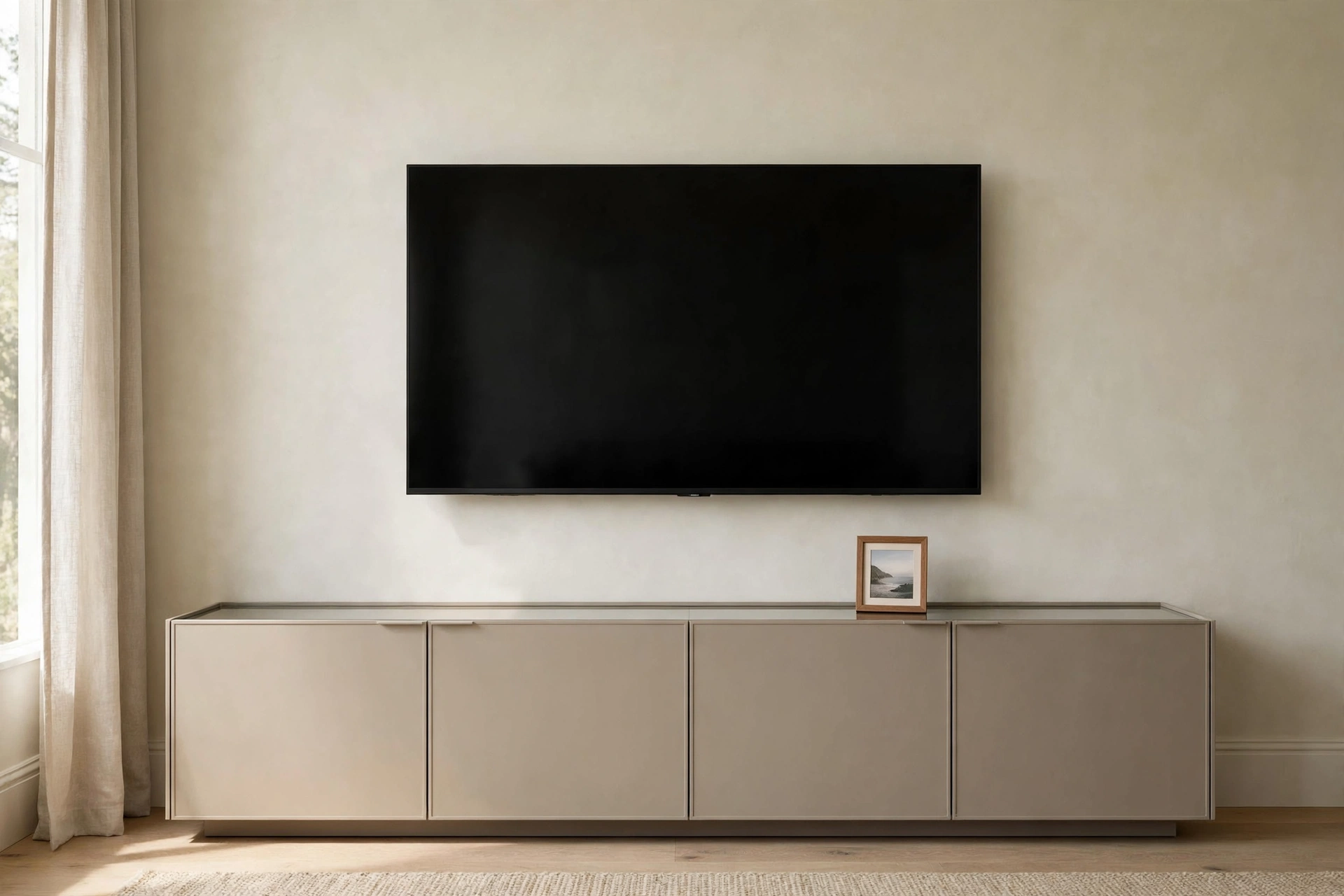 Toy storage ideas living room: closed media console beneath a wall-mounted TV