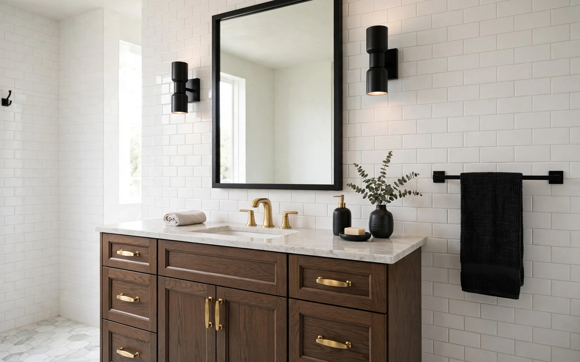 Gold bathroom fixtures ideas mixed with matte black hardware and a black mirror frame